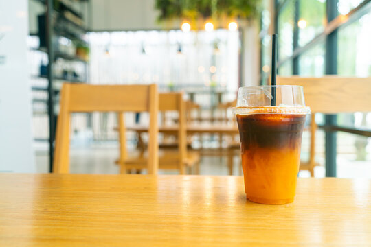 Iced Black Coffee With Yuzu Cup On Table