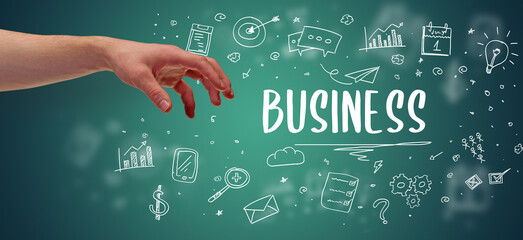 Close-Up of cropped hand pointing at business inscription