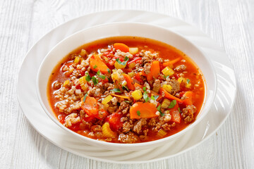 Hamburger Soup with barley and vegetables in bowl
