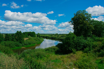 Fototapeta na wymiar landscape. river view with trees. blue sky with clouds. transience of life. High quality photo