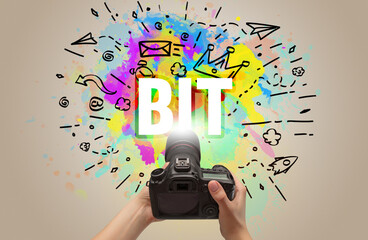 Close-up of a hand holding digital camera with abstract drawing
