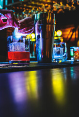 woman hand bartender making negroni cocktail in bar