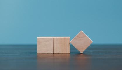 Stacking blank wooden cubes on blue background with copy space for input wording and infographic...