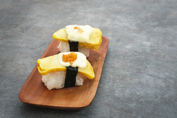 Egg Sushi Rolls or tamago sushi with red caviar, Japanese food
