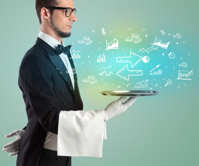 Handsome young waiter in tuxedo holding money icons on tray