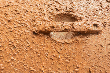 Close-up of dirty mud on the side of car, off-road on adventure, road trip activity.