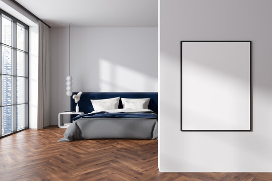 Stylish bedroom interior with bed and panoramic window. Mockup frame