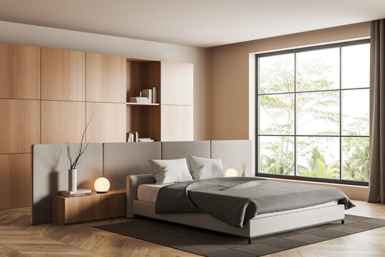 Light bedroom interior with bed and panoramic window, shelf with decor