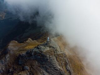 Top of a mountain in the clouds