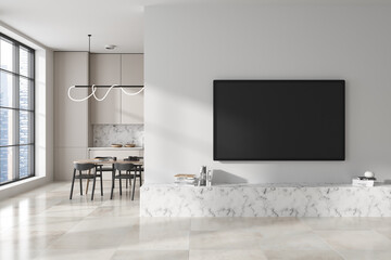 Stylish kitchen interior with dining area and tv with shelf, window