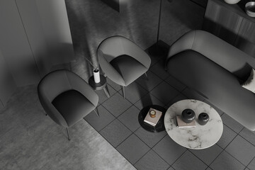 Top view of grey meeting room interior with sofa and coffee table