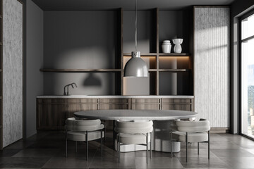 Grey kitchen interior with eating and cooking area, panoramic window