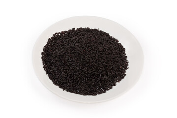 Raw long-grained black rice on a white dish