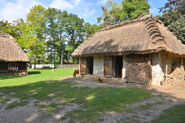 Fototapeta na wymiar Wooden farm buildings in the Lublin Open Air Village Museum