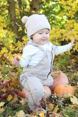 little girl in in autumn park