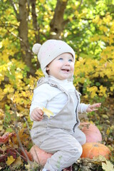 little girl in in autumn park