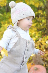 little girl in in autumn park