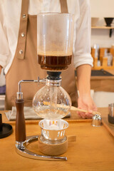 Syphon coffee maker in craft cafe