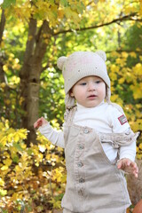 little girl in in autumn park