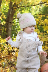 little girl in in autumn park