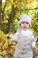 little girl in in autumn park