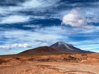 Fototapeta na wymiar Mountain Volcano Ollague stratovolcano on border between Bolivia and Chile. Maestic Andes volcanic mountain landscape in Andean Nature Wilderness Reserve.