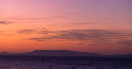 Romantic cloudy sky at sunset. Orange gradient. Sky structure, abstract nature background. copy space.