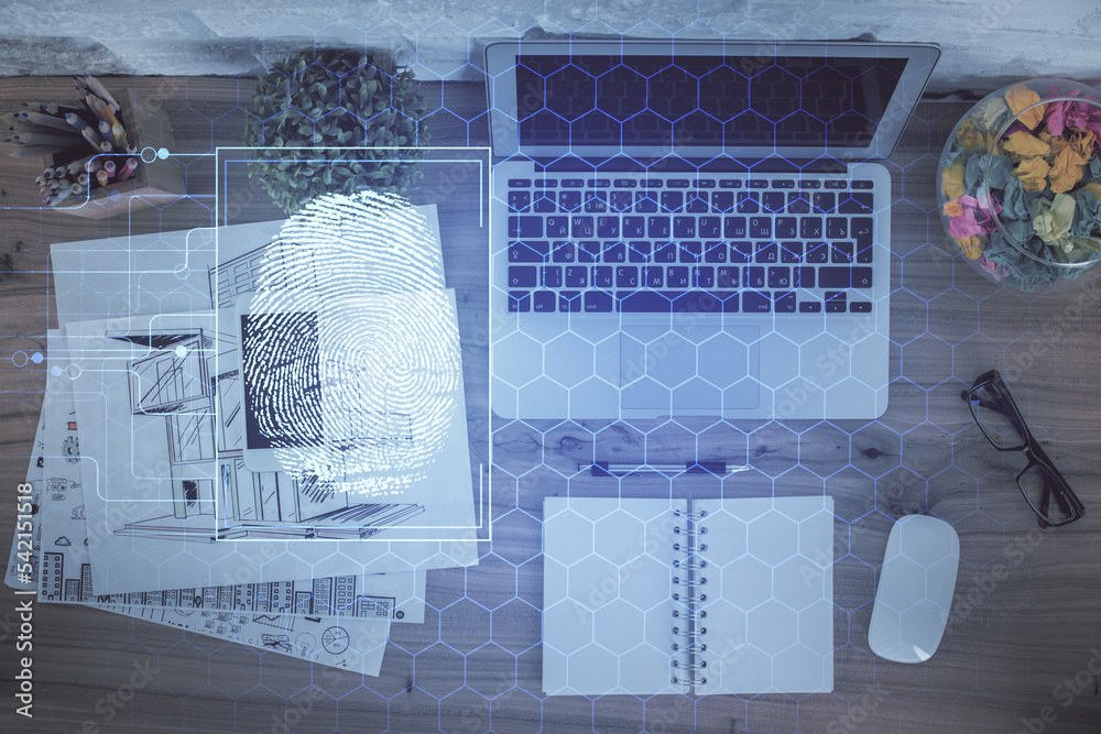 Poster Finger print over computer on the desktop background. Top view. Double exposure. Concept of securitization.