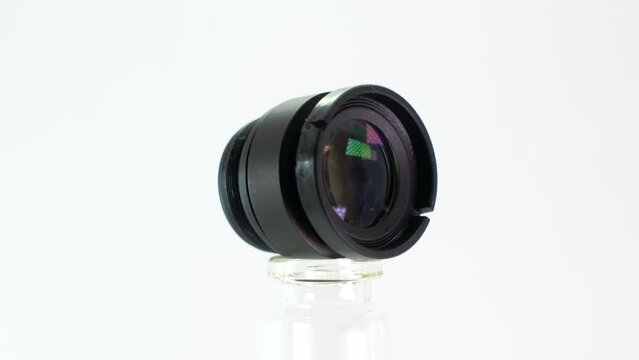 lens of a camera in front of white