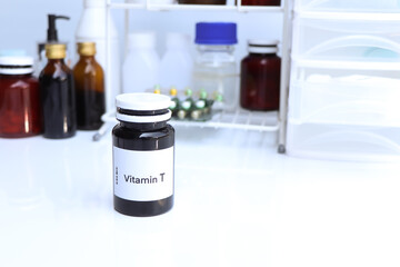 Vitamin T pills in a bottle, food supplement for health