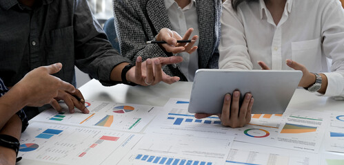 Financial,accounting, investment advisor consulting with her team at office. Teamwork Meeting Concept