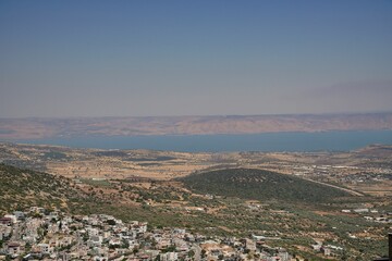 Sea of Galilee with the village and mount Arbel, Golan Heights in the background, Israel, aerial