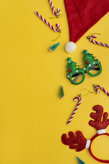 Funny New Year, Christmas accessories for winter holidays party celebration on yellow background