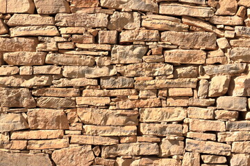 Old medieval yellow wall made from stone