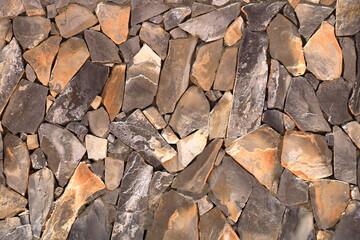 Grey Yellow Stonewall Made From Flagstone And Sandstone Slabs Background, Bumpy Stone Wall Texture, Rocky Structure Backdrop