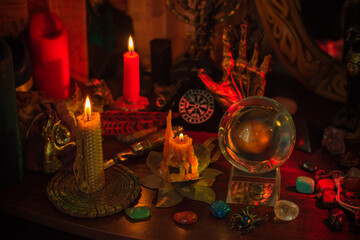 Witch altar. Concept of fortune telling and predictions of fate, candle magic and wicca elements on a table