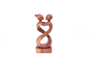 Wooden figurine symbol of love isolated on white background.