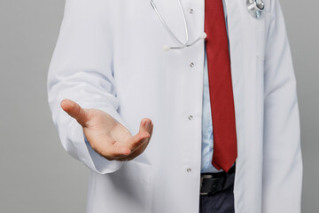 Cropped close up male doctor man wearing white medical gown suit stethoscope work in hospital...
