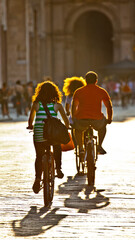 family riding a bicycle in the city