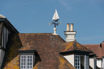 A weather vane on top of a roof