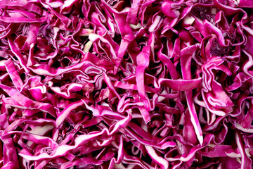 Tasty fresh shredded red cabbage as background, closeup