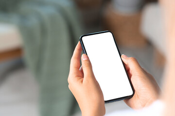Closeup view of woman with smartphone indoors. Space for text