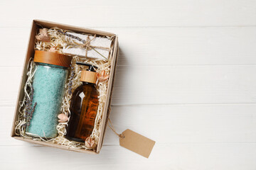 Spa gift set on white wooden table, top view. Space for text