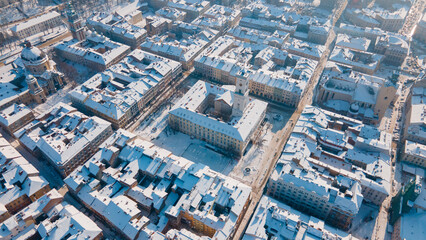 aerial view of lviv city center at snowed winter sunny day - obrazy, fototapety, plakaty
