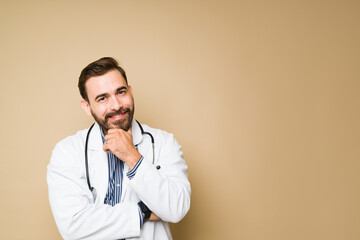 Attractive doctor looking happy while working