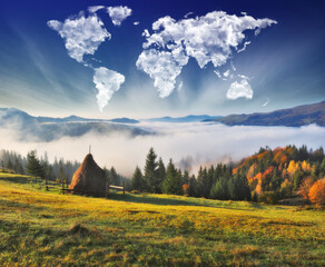 clouds in the form of a map of the world over the mountains. autumn dawn in the Carpathians. Travel...
