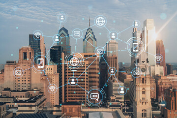 Aerial panoramic cityscape of Philadelphia financial downtown, Pennsylvania, USA. City Hall Clock Tower, sunrise. Social media icons. The concept of networking and establishing people connections