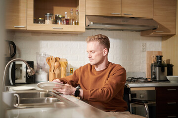 Man with Disability Washing Dishes
