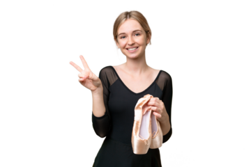 Young English woman practicing ballet over isolated background smiling and showing victory sign