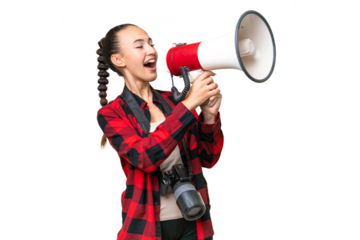Young photographer Arab woman over isolated background shouting through a megaphone